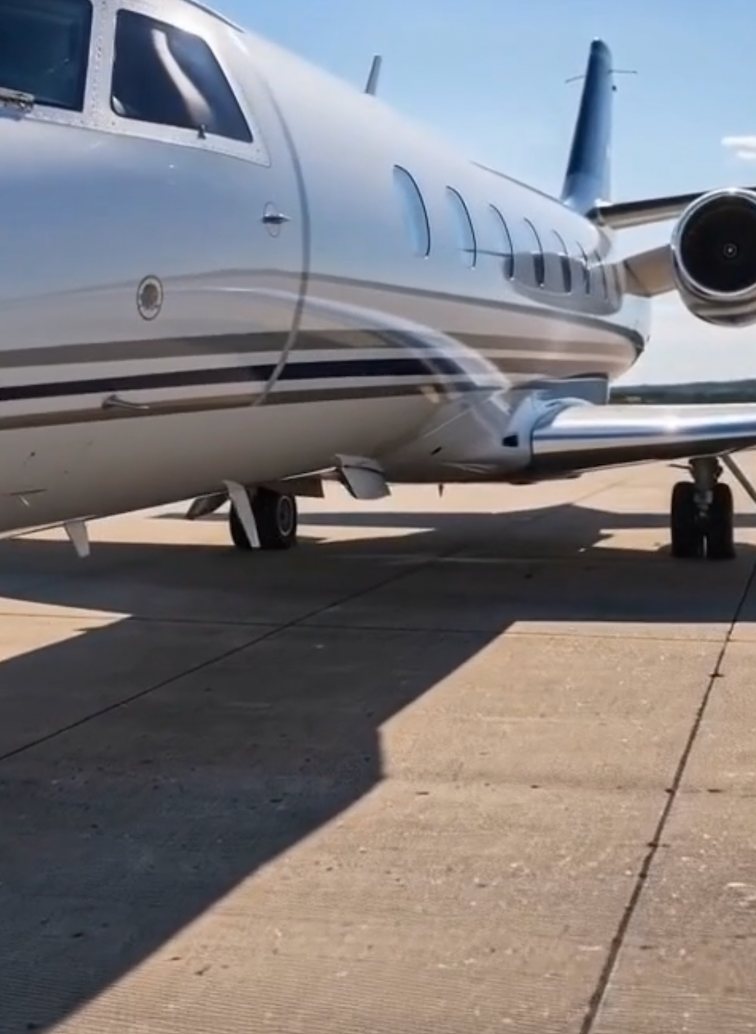 Close-up of white jet fuselage and shadow